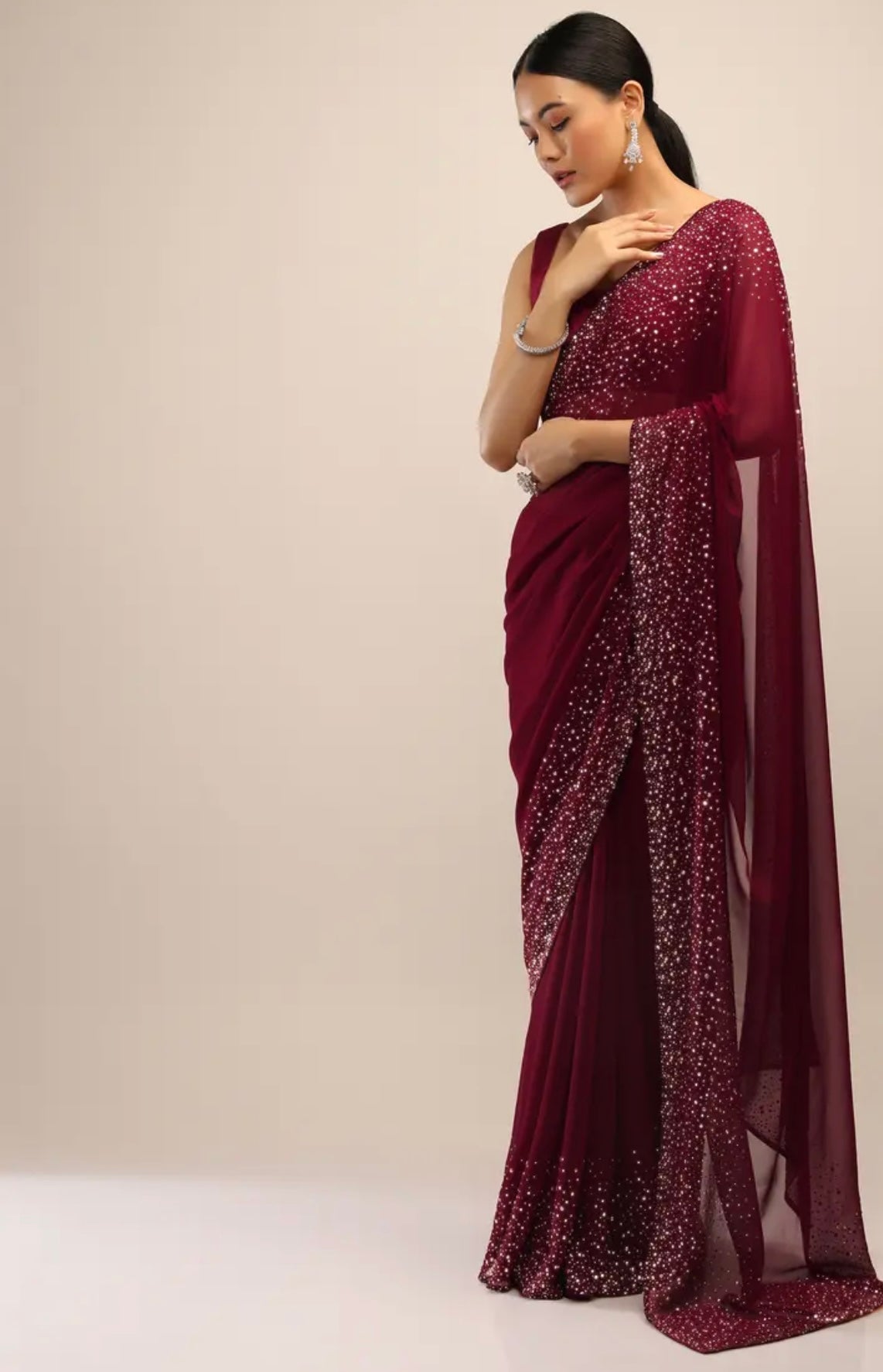 Maroon Saree In Georgette With Kundan Embellished Border